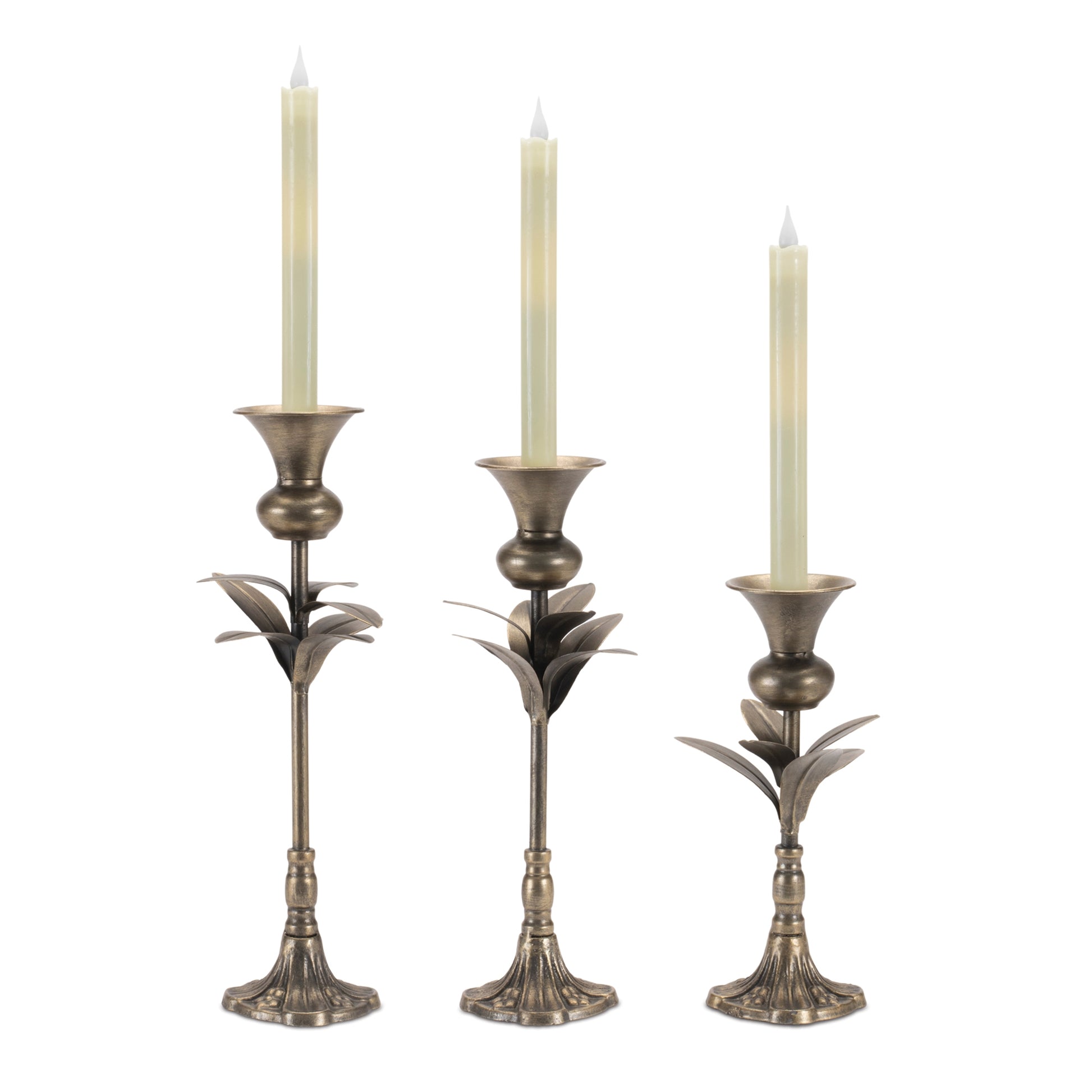 three candelabras with candle in them  